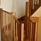 Oak winding staircase with under stairs storage cupboard and step lighting (view1)